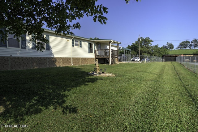 1872 Mitchell Farm Rd, Sevierville, TN 37876 - fenced backyard featuring a deck