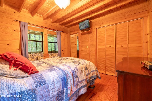 861 Windy Hill Way, Cosby, TN 37722 - bedroom featuring wooden walls, a wood ceiling with exposed beams, and light wood finished floors