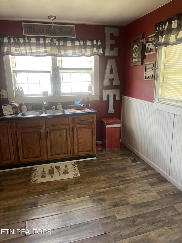 189 Bacon St, Jellico, TN 37762 - kitchen featuring dark wood-style flooring, wainscoting, and brown cabinetry