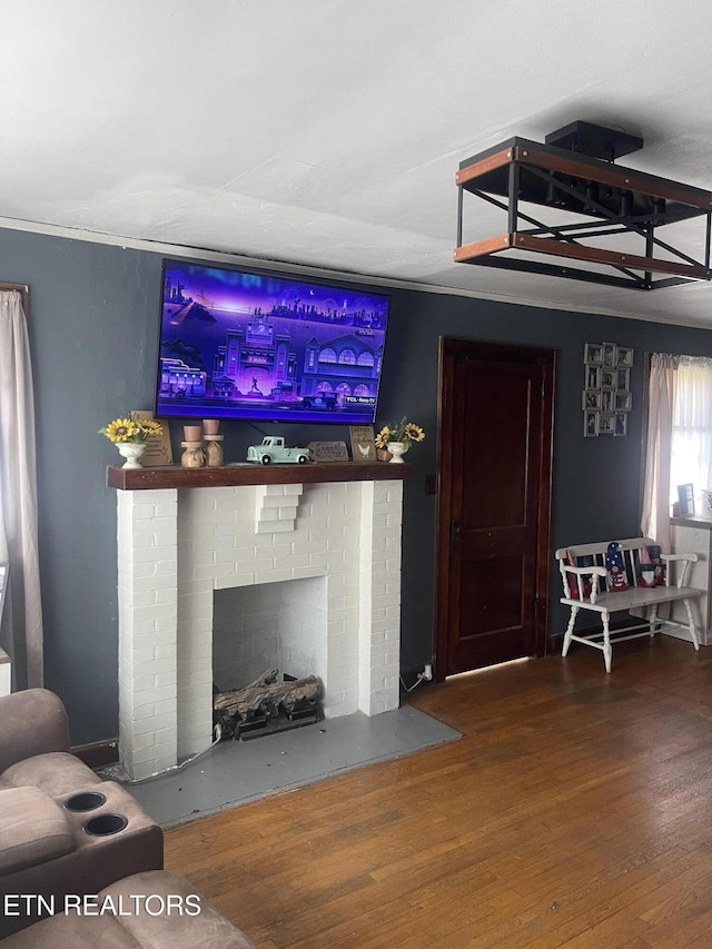 189 Bacon St, Jellico, TN 37762 - living area with wood finished floors and a brick fireplace