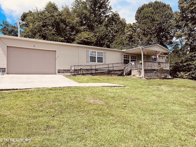 142 Lone Holly Ln, New Tazewell, TN 37825 - view of front of house featuring a garage, a front yard, concrete driveway, and covered porch