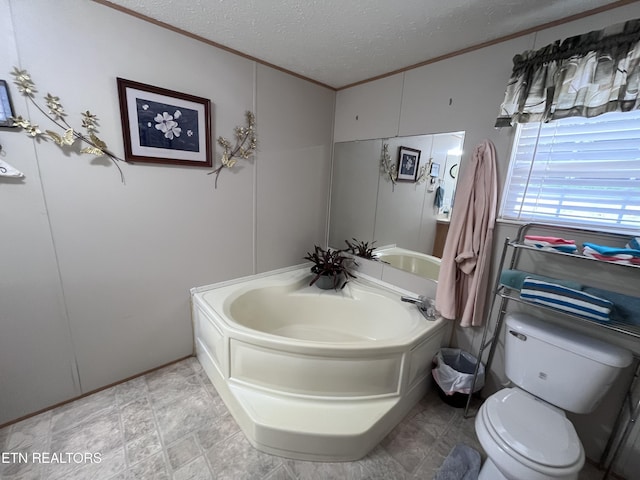 142 Lone Holly Ln, New Tazewell, TN 37825 - bathroom with a textured ceiling, crown molding, a garden tub, and a decorative wall
