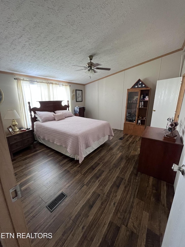 142 Lone Holly Ln, New Tazewell, TN 37825 - bedroom featuring crown molding, dark wood finished floors, a textured ceiling, and a ceiling fan
