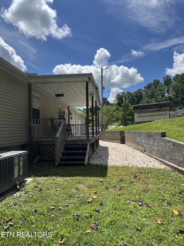 142 Lone Holly Ln, New Tazewell, TN 37825 - view of green lawn with a deck
