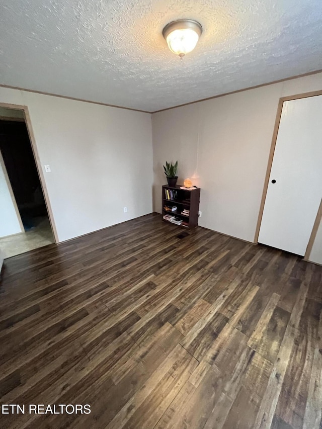 142 Lone Holly Ln, New Tazewell, TN 37825 - empty room with wood finished floors and a textured ceiling