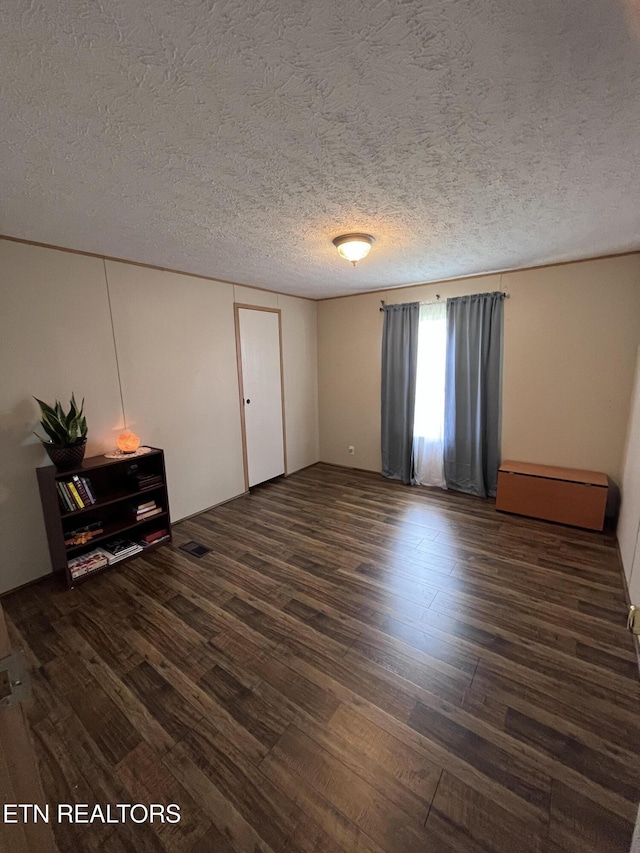 142 Lone Holly Ln, New Tazewell, TN 37825 - spare room with wood finished floors and a textured ceiling