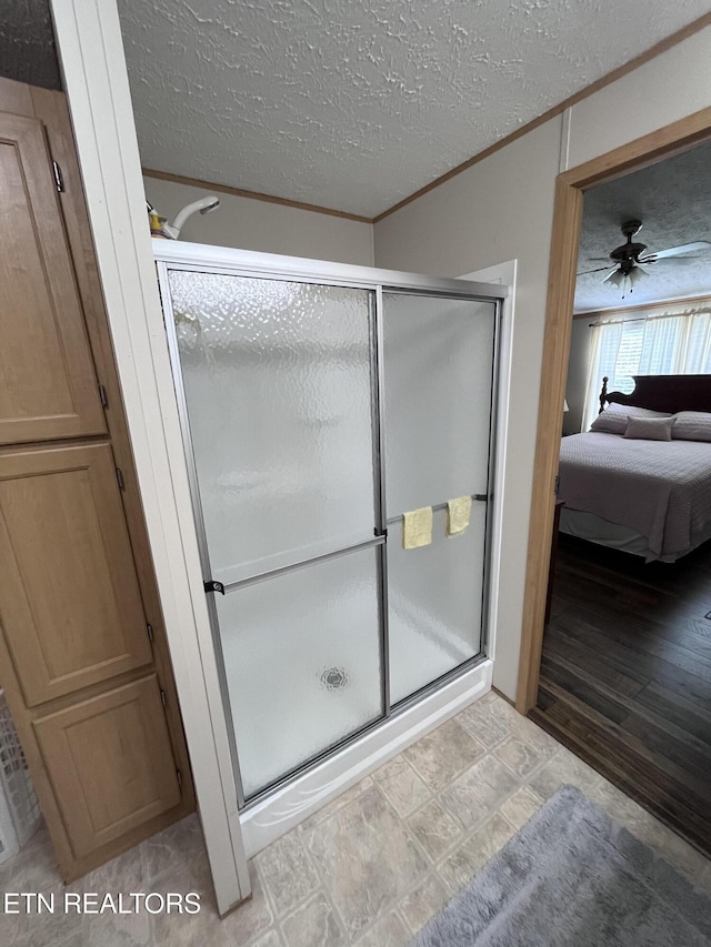 142 Lone Holly Ln, New Tazewell, TN 37825 - full bathroom featuring ensuite bath, a shower stall, crown molding, a textured ceiling, and ceiling fan