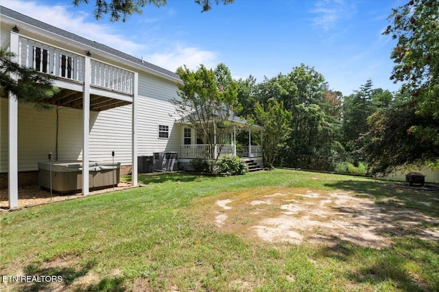 440 Indian Hills Rd, Oneida, TN 37841 - view of green lawn featuring a hot tub and a deck