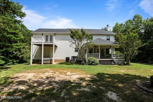 440 Indian Hills Rd, Oneida, TN 37841 - back of property featuring a chimney, a lawn, ceiling fan, and a porch