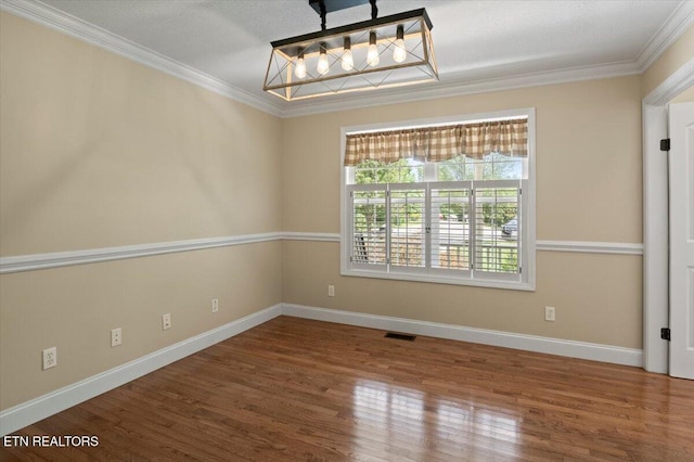 440 Indian Hills Rd, Oneida, TN 37841 - unfurnished room featuring ornamental molding, wood finished floors, and a chandelier