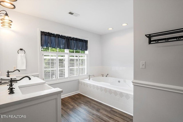 440 Indian Hills Rd, Oneida, TN 37841 - bathroom with a bath, wood finished floors, double vanity, and recessed lighting