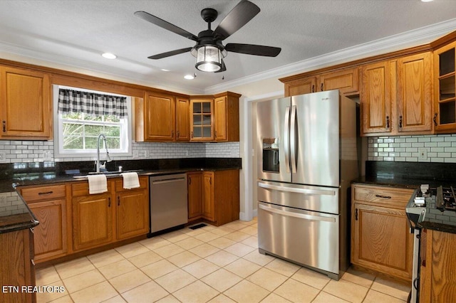 440 Indian Hills Rd, Oneida, TN 37841 - kitchen with appliances with stainless steel finishes, brown cabinets, crown molding, decorative backsplash, and glass insert cabinets
