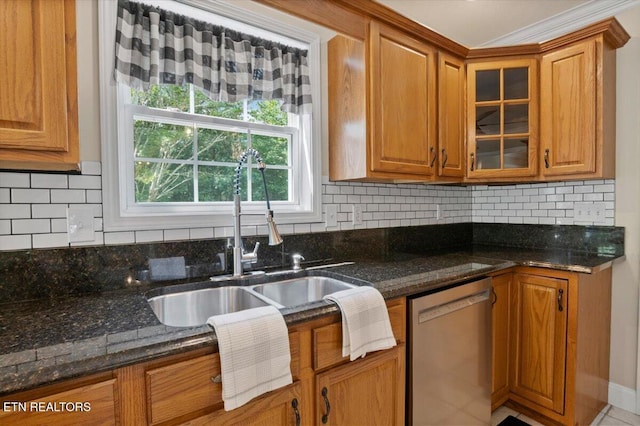 440 Indian Hills Rd, Oneida, TN 37841 - kitchen with stainless steel dishwasher, brown cabinetry, glass insert cabinets, dark stone counters, and backsplash