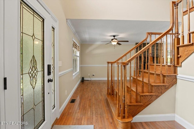 440 Indian Hills Rd, Oneida, TN 37841 - entryway featuring light wood-style floors, stairs, ceiling fan, and ornamental molding
