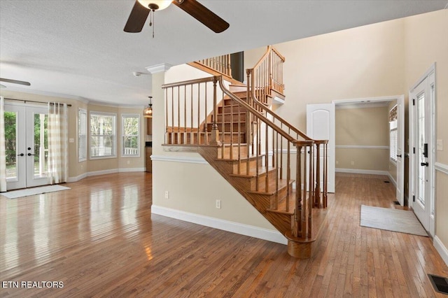 440 Indian Hills Rd, Oneida, TN 37841 - foyer featuring french doors, a ceiling fan, hardwood / wood-style floors, and stairway
