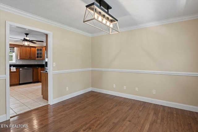 440 Indian Hills Rd, Oneida, TN 37841 - unfurnished dining area featuring light wood-type flooring, ornamental molding, and ceiling fan
