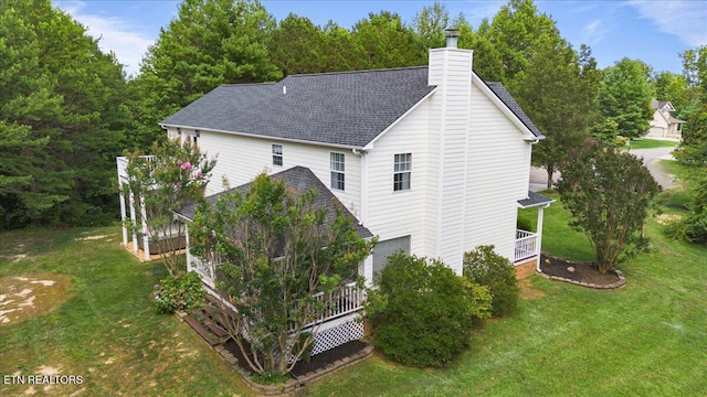 440 Indian Hills Rd, Oneida, TN 37841 - view of side of property featuring a chimney, a lawn, a shingled roof, and a deck
