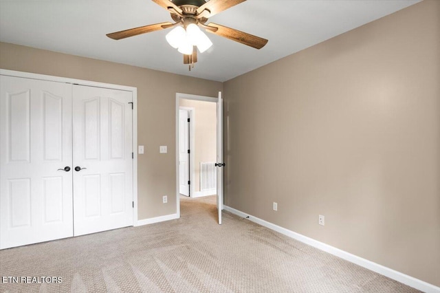 440 Indian Hills Rd, Oneida, TN 37841 - unfurnished bedroom with carpet floors, a closet, and ceiling fan