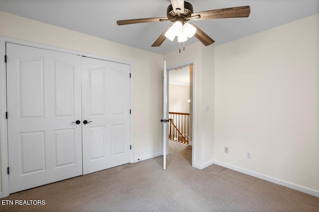 440 Indian Hills Rd, Oneida, TN 37841 - unfurnished bedroom featuring carpet flooring, a closet, and ceiling fan