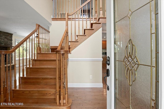 440 Indian Hills Rd, Oneida, TN 37841 - stairway featuring wood finished floors and a towering ceiling