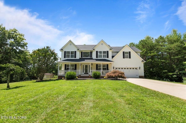 440 Indian Hills Rd, Oneida, TN 37841 - view of front of home featuring covered porch, driveway, an attached garage, and a front yard