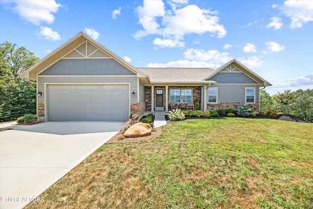 1721 Holly Bend Dr, Byrdstown, TN 38549 - craftsman inspired home featuring stone siding, a front yard, driveway, an attached garage, and covered porch
