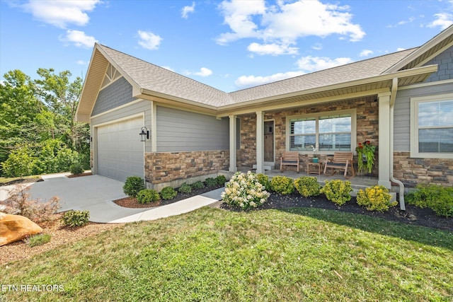1721 Holly Bend Dr, Byrdstown, TN 38549 - ranch-style house with stone siding, covered porch, a garage, driveway, and roof with shingles