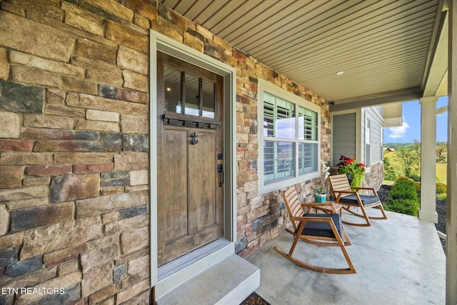1721 Holly Bend Dr, Byrdstown, TN 38549 - property entrance featuring stone siding and covered porch