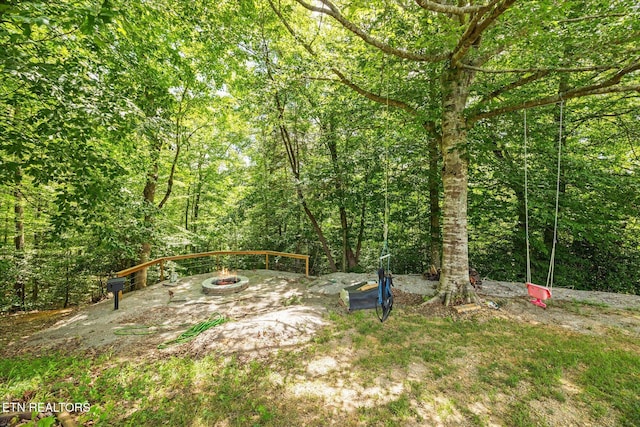1721 Holly Bend Dr, Byrdstown, TN 38549 - view of yard featuring an outdoor fire pit and a view of trees
