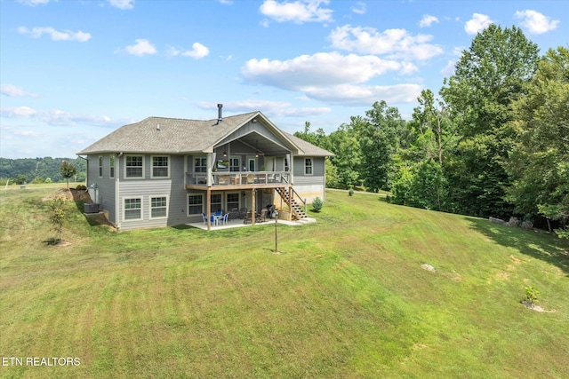 1721 Holly Bend Dr, Byrdstown, TN 38549 - rear view of house with a deck, a patio, a yard, stairway, and roof with shingles