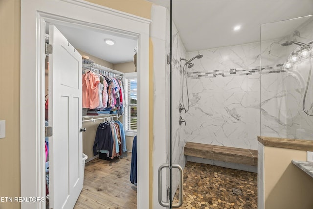 1721 Holly Bend Dr, Byrdstown, TN 38549 - full bathroom with a marble finish shower, a walk in closet, recessed lighting, and wood finished floors