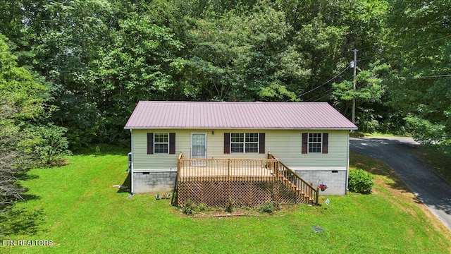 546 Park Rd, Caryville, TN 37714 - view of front of home with crawl space, a front yard, a metal roof, a deck, and stairway