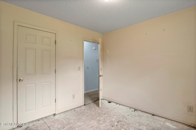 546 Park Rd, Caryville, TN 37714 - unfurnished bedroom featuring baseboards and a textured ceiling