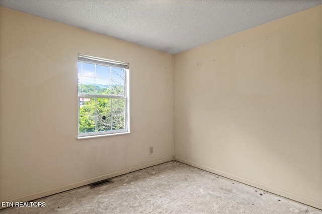 546 Park Rd, Caryville, TN 37714 - empty room featuring baseboards and a textured ceiling