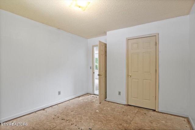 546 Park Rd, Caryville, TN 37714 - empty room featuring baseboards and a textured ceiling