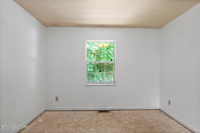 546 Park Rd, Caryville, TN 37714 - empty room with a textured ceiling and baseboards