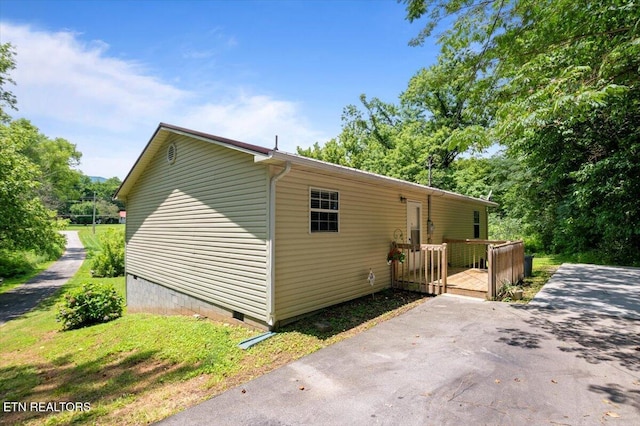 546 Park Rd, Caryville, TN 37714 - view of property exterior with crawl space and a wooden deck