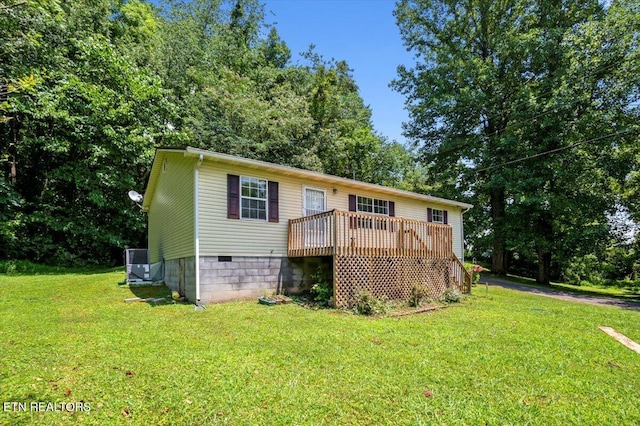 546 Park Rd, Caryville, TN 37714 - rear view of house with crawl space, a wooden deck, a yard, and view of scattered trees