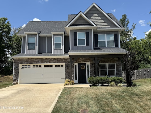 1139 Aspen Glen Dr, Alcoa, TN 37701 - craftsman inspired home featuring concrete driveway, an attached garage, stone siding, board and batten siding, and a shingled roof