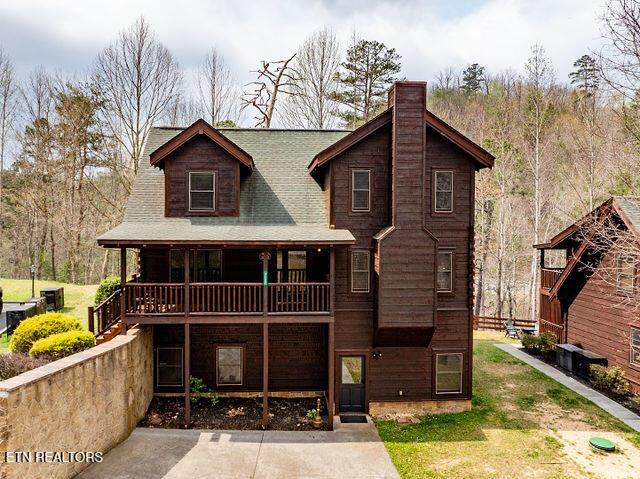 3322 Covered Bridge Way, Sevierville, TN 37862 - view of front of property with a chimney and a shingled roof