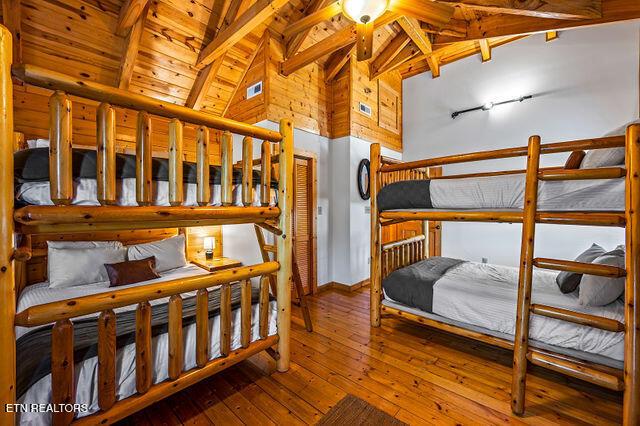 3322 Covered Bridge Way, Sevierville, TN 37862 - bedroom featuring wood-type flooring, a wood ceiling with exposed beams, and high vaulted ceiling