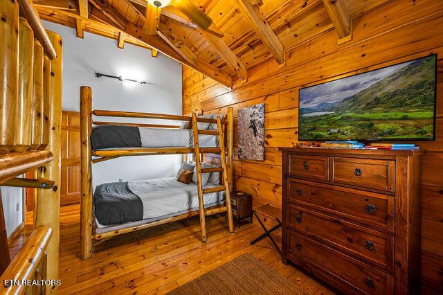 3322 Covered Bridge Way, Sevierville, TN 37862 - bedroom featuring hardwood / wood-style floors, wooden walls, and wooden ceiling