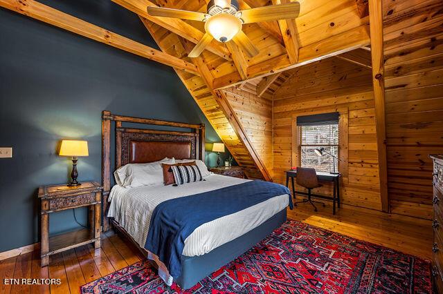 3322 Covered Bridge Way, Sevierville, TN 37862 - bedroom with wood-type flooring, wooden ceiling, and wooden walls
