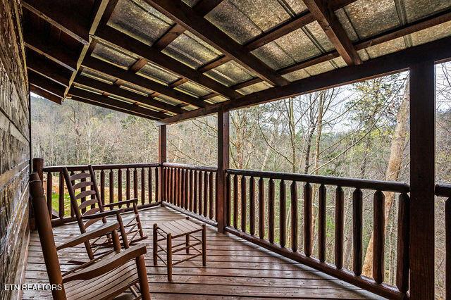 3322 Covered Bridge Way, Sevierville, TN 37862 - wooden deck featuring a view of trees