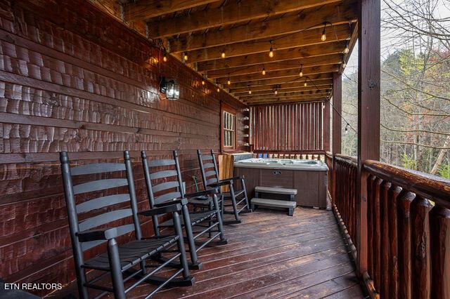 3322 Covered Bridge Way, Sevierville, TN 37862 - wooden deck featuring a hot tub