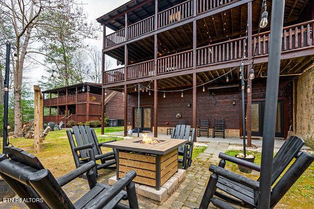 3322 Covered Bridge Way, Sevierville, TN 37862 - view of patio featuring an outdoor fire pit