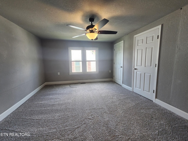 308 E Prospect St, Lafollette, TN 37766 - unfurnished bedroom with carpet, a textured ceiling, a ceiling fan, and a textured wall