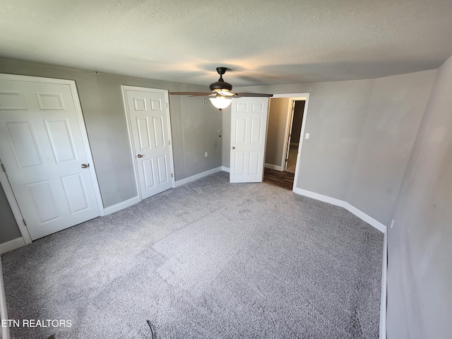 308 E Prospect St, Lafollette, TN 37766 - unfurnished bedroom featuring carpet floors, a textured ceiling, and a ceiling fan