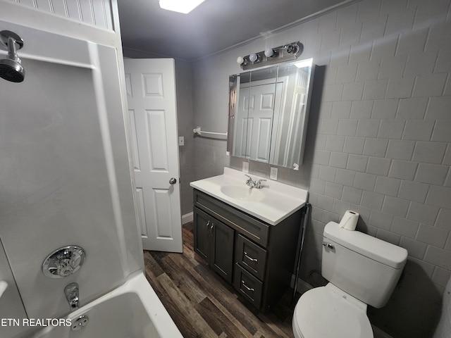 308 E Prospect St, Lafollette, TN 37766 - full bathroom with vanity, wood finished floors, and shower / washtub combination