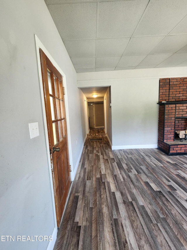 308 E Prospect St, Lafollette, TN 37766 - unfurnished living room with wood finished floors and a paneled ceiling
